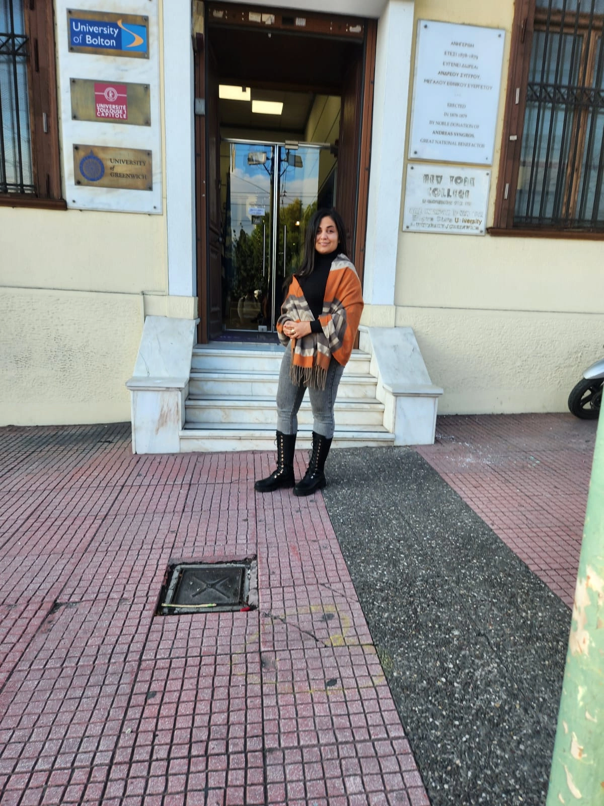 teacher standing before a university